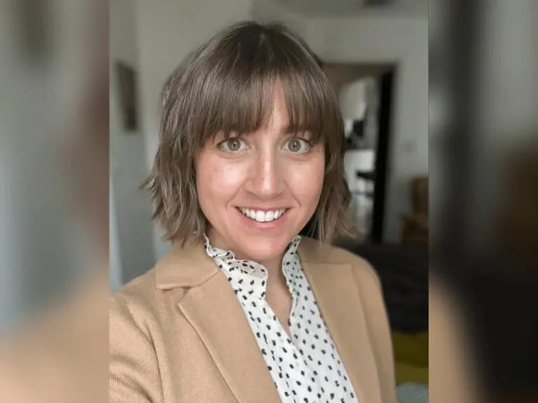 Casting Director Chrissy Fiorilli-Ellington, CSA in a brown jacket smiling.