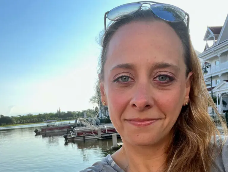 Selfie of casting director Maribeth Fox smiling outside by the water.