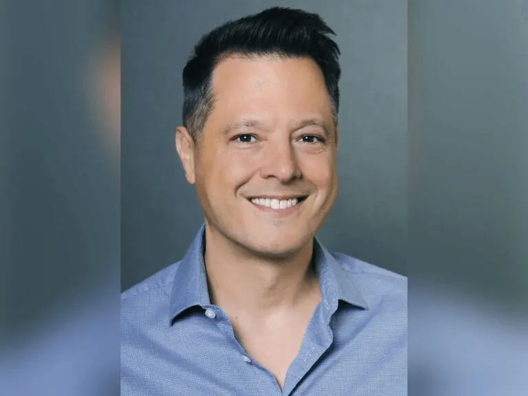 Casting Director Rich Delia in a blue shirt smiling.