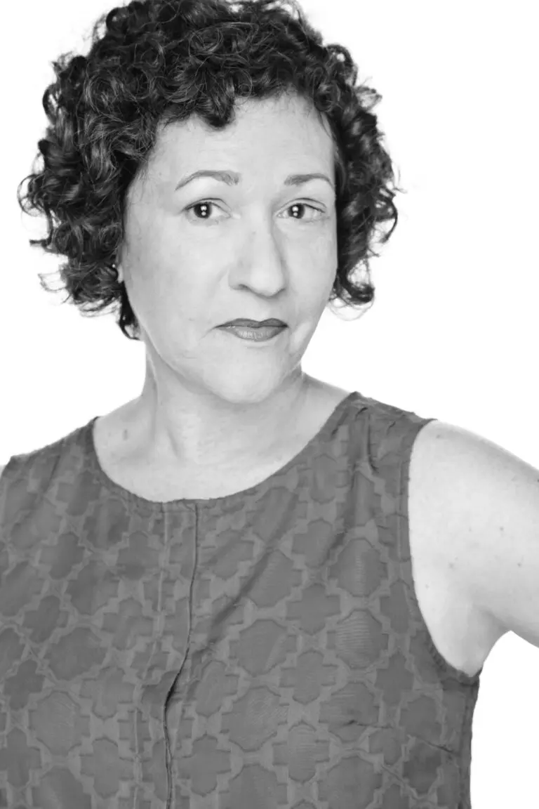 Black and white photo of Drew Ann Borsos smiling.