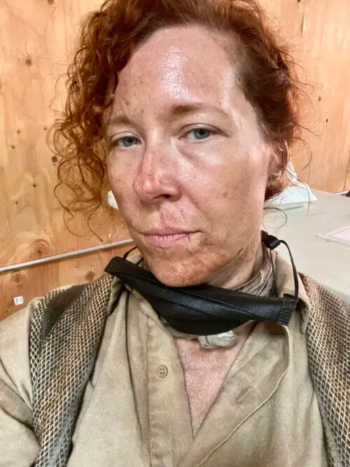 Christina Largent in a steampunk villager costume on the set of Rebel Moon.