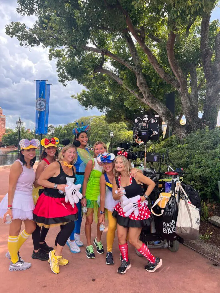 Actor Amy Mckillop and friends posing in front of a camera at Disney World