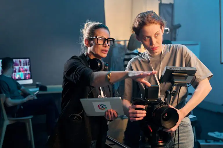 Female director giving instructions to camera operator inside during a shoot.