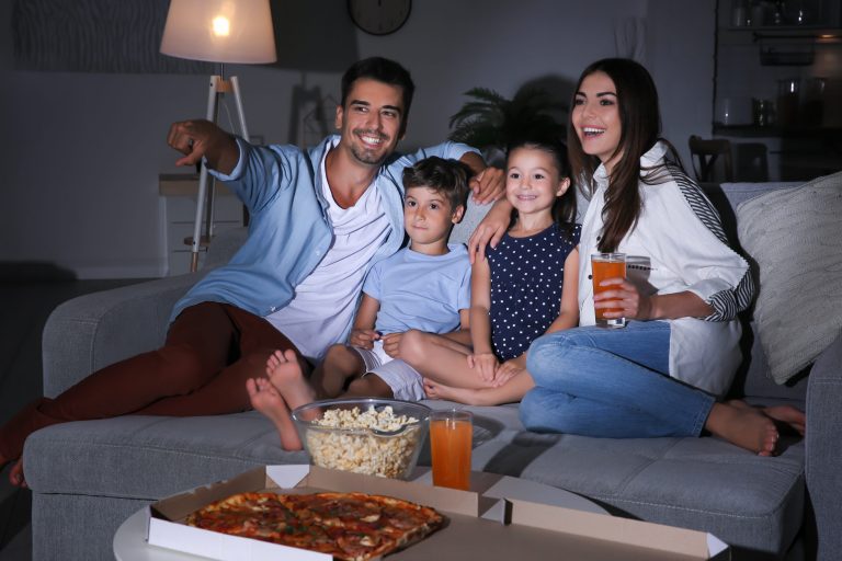 A family watching one of the February television premiers we've recommended on this list.