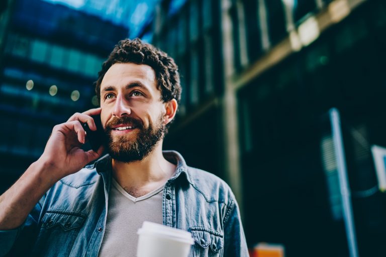 Bearded young actor on the phone with his agent about projects casting in L.A. this week.
