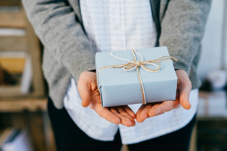 An actor receiving one of the presents from our holiday gift guide for actors.