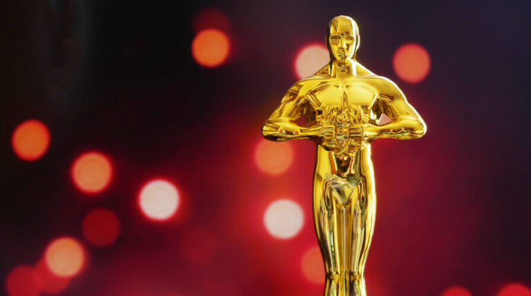 An Oscar award awaiting the Best Supporting Actress winner.