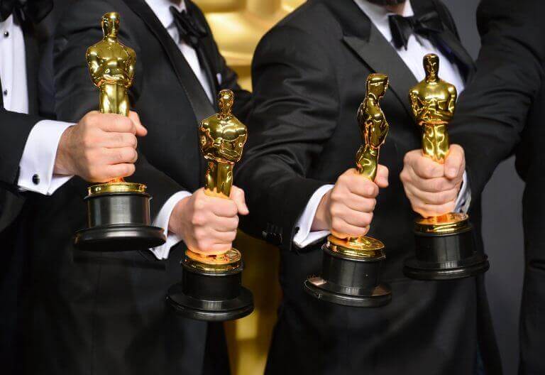 Several of the best supporting actors holding their well-deserved Oscars.
