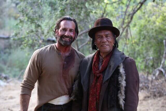 Kevin Makely & Wes Studi on the set of Badland, an unlikely hero of a film to watch during a pandemic.