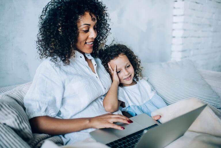 A mother and child watching one of the 3 features released early from streaming services.