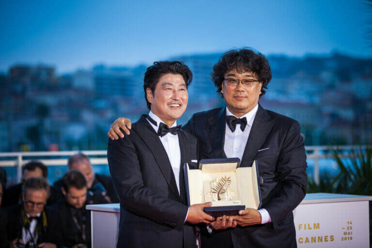 Director Bong Joon-Ho with Kang-Ho Song, winner of the Palme d'Or award for his film "Parasite," which is also one of our picks to watch during Asian/Pacific American Heritage Month.