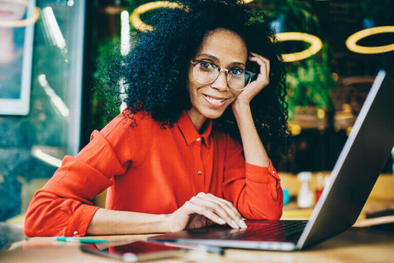 Woman on her laptop looking at activities to do this month.