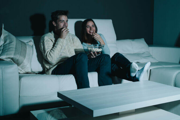 A couple watching some of the productions that have been recently released on streaming services.