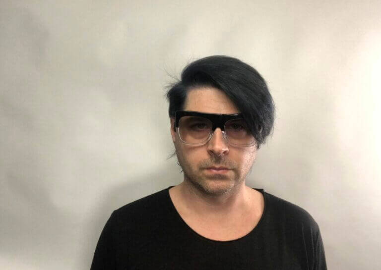 Portrait of. Ezrah Lockwood wearing glasses