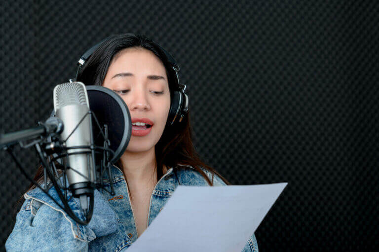 A voice actress going to the booth after getting the essentials for her at-home studio.