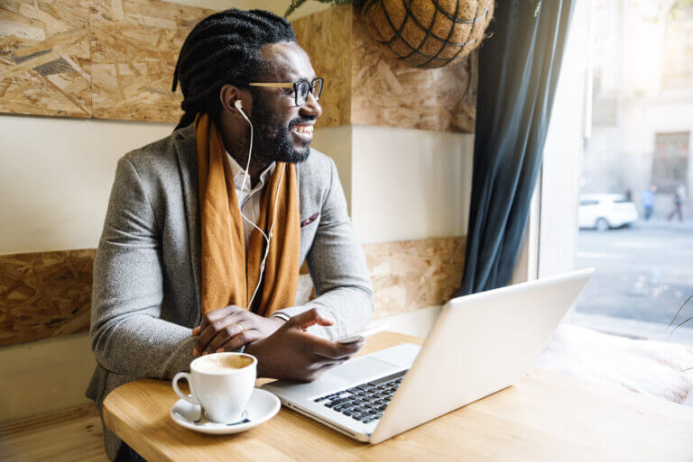 An actor at his favorite coffee shop researching activities he can do this month.
