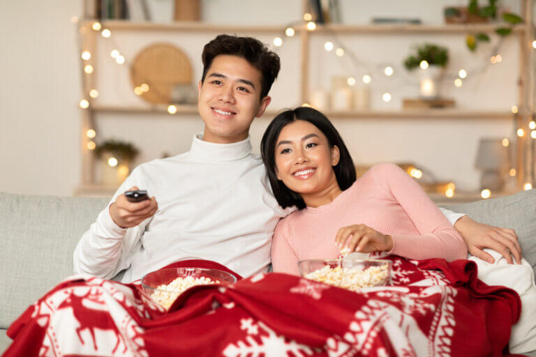 A happy actor couple watching 4 movies streaming this month.