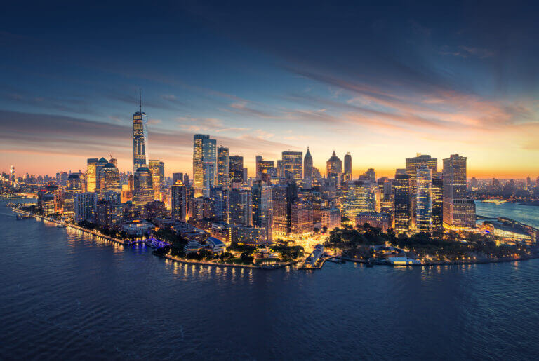 Panoramatic shot of New York City at night.