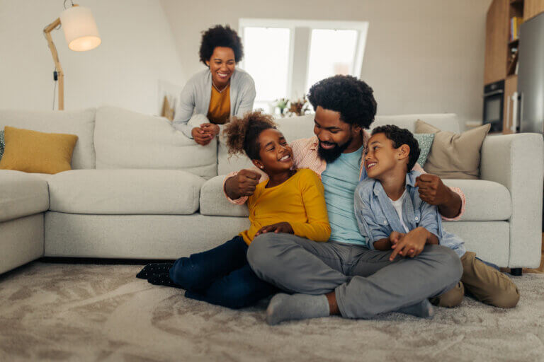 An actor and her family sitting down to watch several new movies streaming this month.