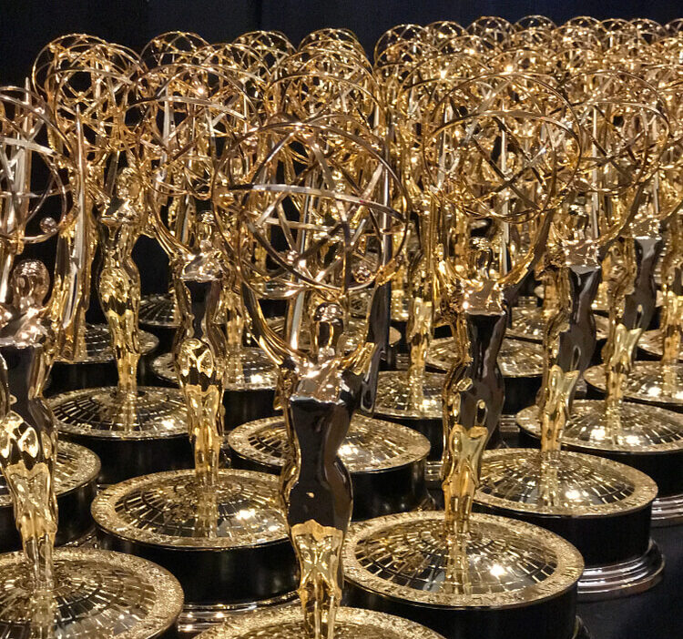 A collection of Emmys going to various actors. Here are our Emmy predictions for the Best Actor and Actress in a Movie or Miniseries Winners.