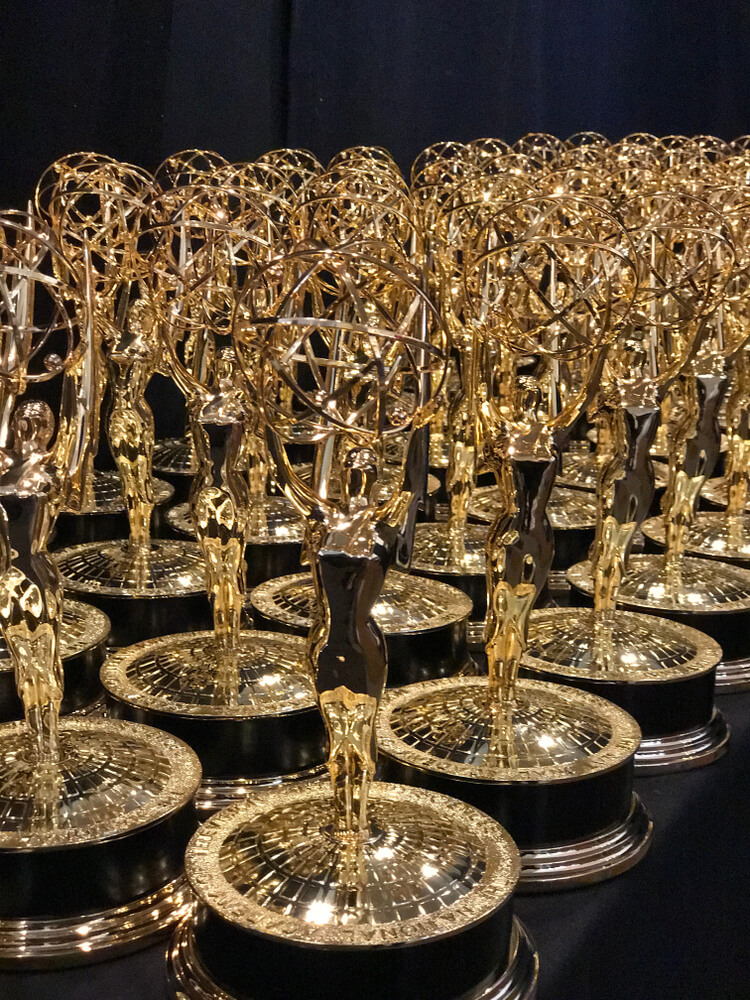 A collection of Emmys going to various actors. Here are our Emmy predictions for the Best Actor and Actress in a Movie or Miniseries Winners.