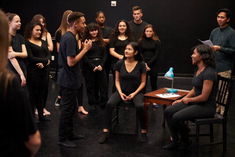 An improv class learning how improv can help actors with their scripted acting performances.