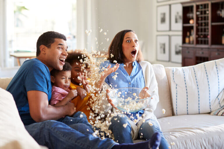 A family of actors watching several movies on streaming that they did not want to miss.