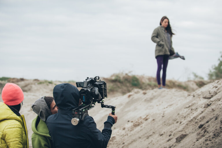 Actress being filmed by a project creator that released their projects to the right actors in the right location.