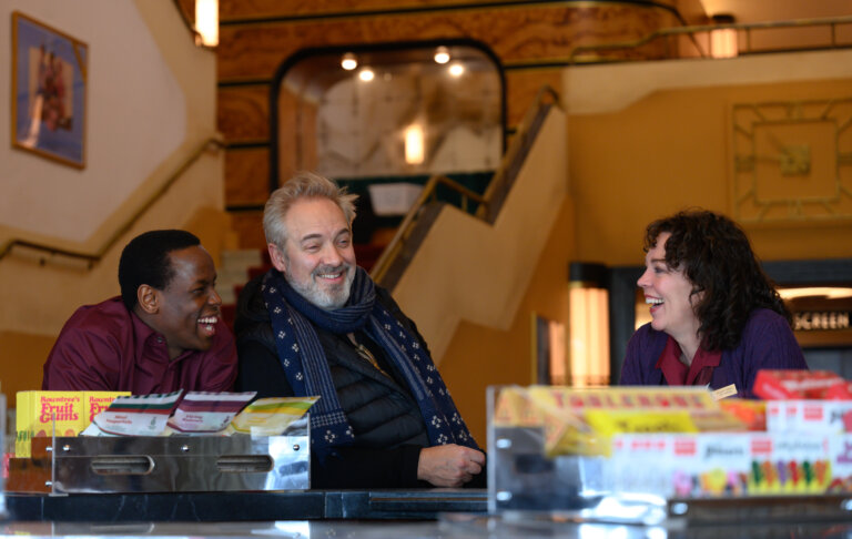 Sam Mendes, Olivial Colman and Micheal Ward going over their scenes and work in the film Empire of Light..