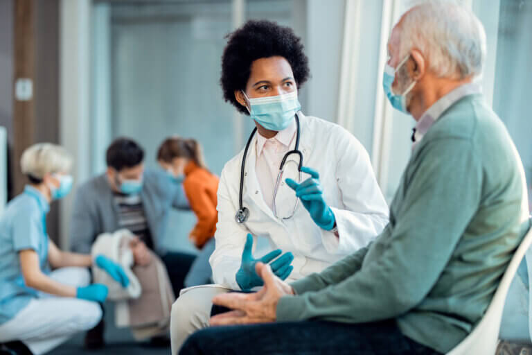 A doctor on set treating an actor patient.