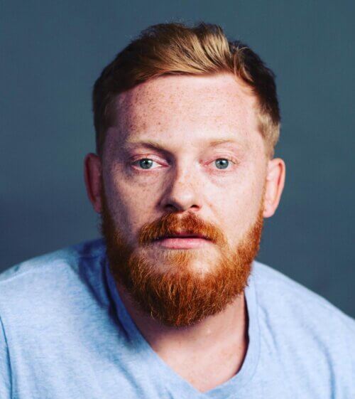 Casting Director Mathew Waters wearing a blue shirt.