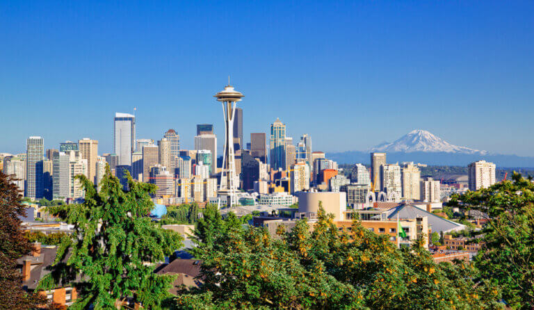 Seattle, Washington skyline during the day with Mt. Rainier in the background.