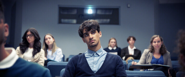 Actor Hakim Brahimi in a classroom in the movie Montréal Girls.