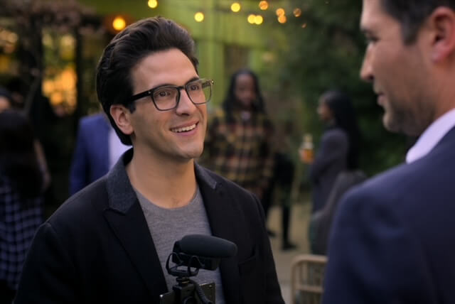 Actor Matt Angel smiling at a party outdoors.