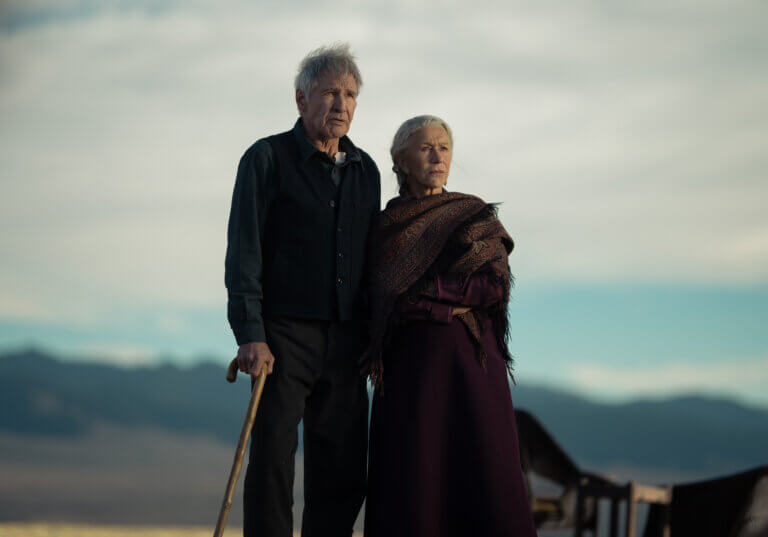 Harrison Ford and Hellen Mirren in old Western clothes outside.
