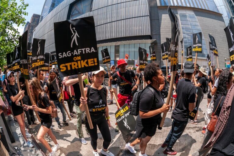 SAG-AFTRA members on strike outside in New York City.