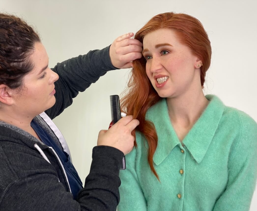 Special effects artist working on a character sculpture.