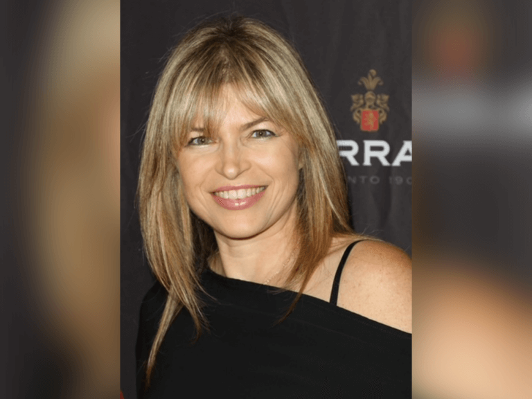 Susie Farris in a black shirt smiling at an awards show.