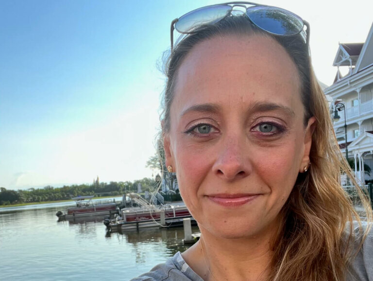 Selfie of casting director Maribeth Fox smiling outside by the water.