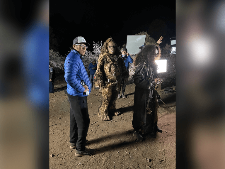 Sung Kang, monsters and lighting on the set of the film Skaky Shivers at night.
