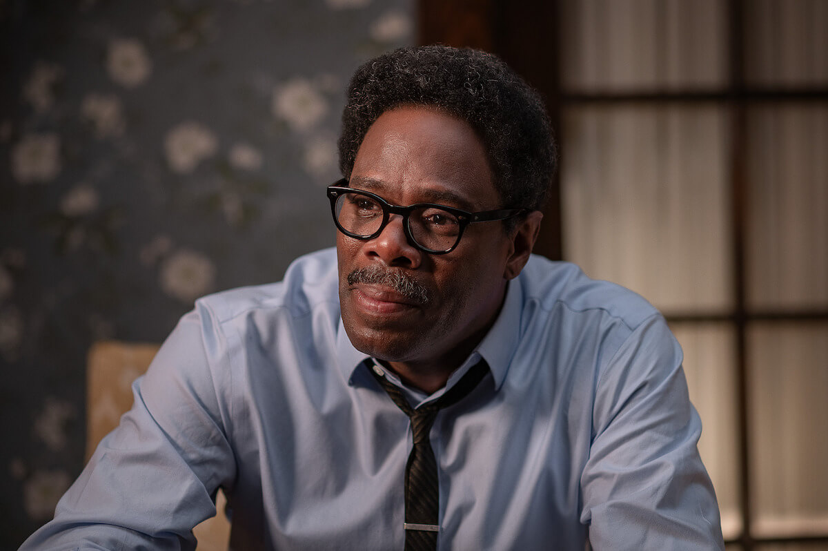 Coleman Domingo as Bayard Rustin sittign in a chair.