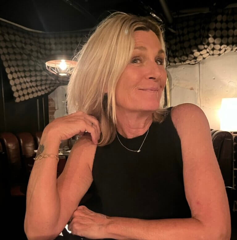 Laray Mayfield smiling on-set.