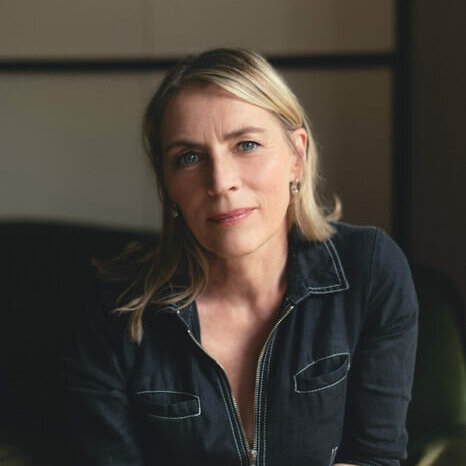 Saskia Reeves in a denim jacket smiling.