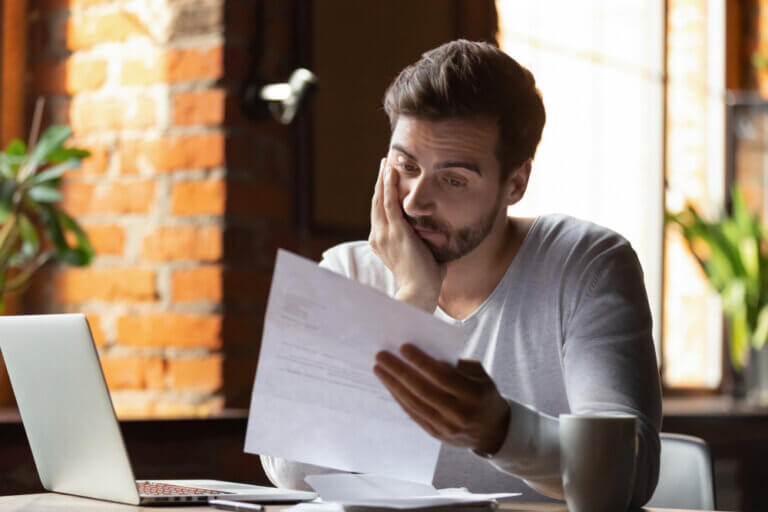 Sad man looking at a script inside.