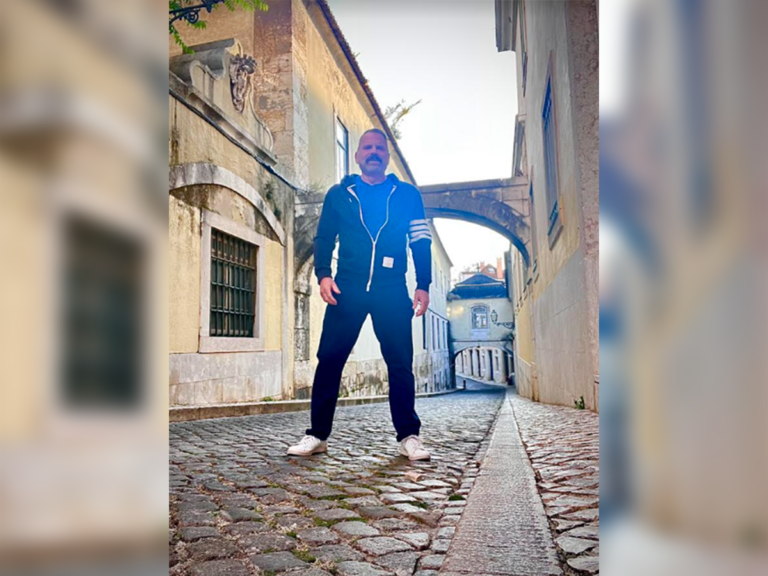 Casting Director Joseph Middleton standing in the middle of a cobblestone street.
