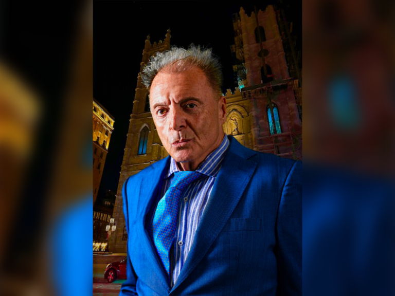 Actor Armand Assante in a blue suit outside of St. Patricks's Cathedral in New York City.