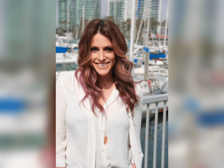 Casting Director Robyn Kass smiling by the water in Los Angeles.