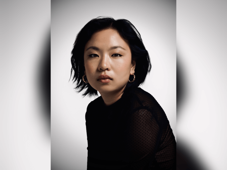 Actor and writer Grace Chow wearing all black on a white background.