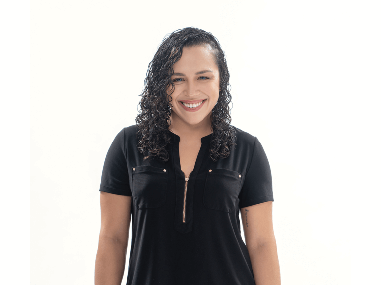 Rachel Espendez smiling in a black button down shirt.