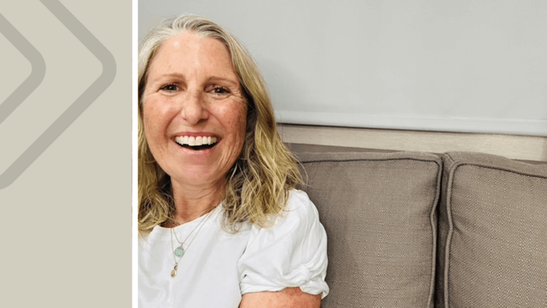 Casting Director Liz Dean sitting down on a couch, smiling. Casting networks logo on a tan banner to the right.
